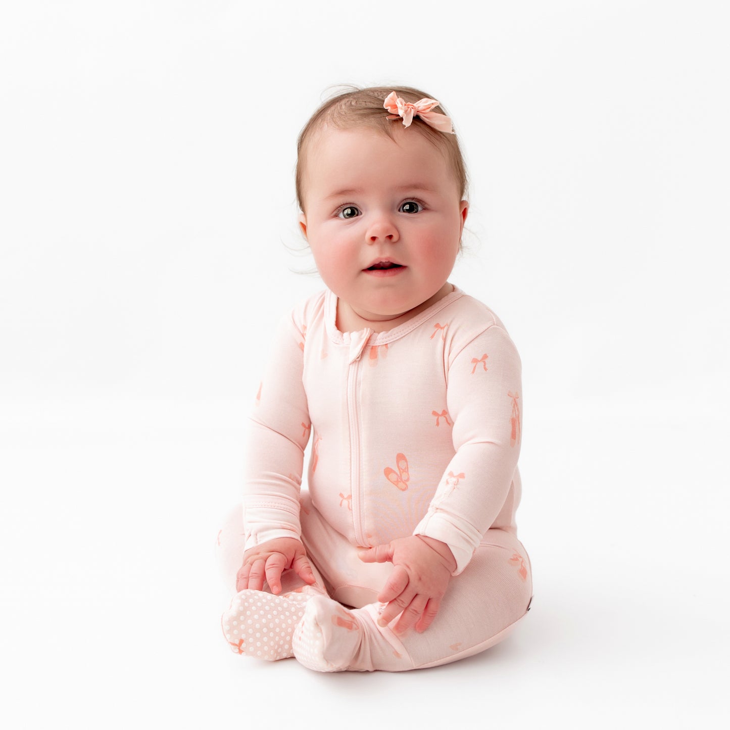 Soft bamboo baby footie pajamas with ballerina design and fold-over mittens