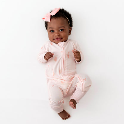 baby in pink ballerina romper made from bamboo viscose