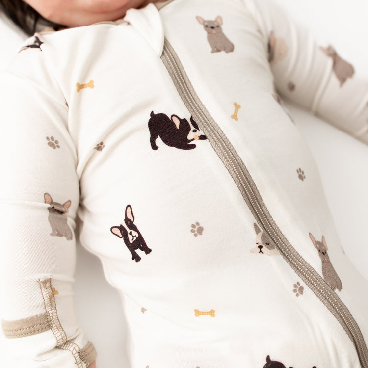 Close-up of soft bamboo fabric on french bulldog baby footie
